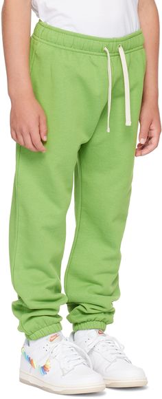 GOTS-certified organic cotton French terry sweatpants. · Drawstring at elasticized waistband · Three-pocket styling · Embroidered logo patch at front · Machine-wash Supplier color: Herb green Model measures 54” / 137.2 cm tall and wears size 8-10Y. Acne Studios Size: child's height 3-4Y: 38.5-40 / 98-104 cm 4-6Y: 40-45.5 / 104-116 cm 6-8Y: 45.5-50 / 116-128 cm 8-10Y: 50-55 / 128-140 cm Spring Green Joggers With Side Pockets, Green Sweatpants With Side Pockets For Spring, Green Cotton Sweatpants With Drawstring, Green Sporty Joggers With Drawstring, Green Sweatpants With Elastic Waistband For Loungewear, Green Cotton Joggers For Spring, Green Cotton Sweats With Ribbed Cuffs, Green Athleisure Pants With Ribbed Cuffs, Green Cotton Sweats For Spring