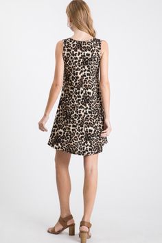 This leopard printed sleeveless mini dress features thick tank straps, a v neck line and side pockets. Flowy fit and falls above the knee. Can be dressed up or down with different shoes. Leopard Print Dress, Sleeveless Mini Dress, Fit And Flare Dress, Above The Knee, Flare Dress, The Knee, Fit And Flare, Print Dress, Leopard Print