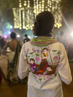 the back of a woman's jacket with an image of two women on it