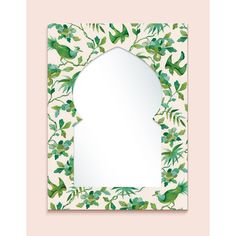 a mirror with green leaves on it and a bird in the middle, against a pink background