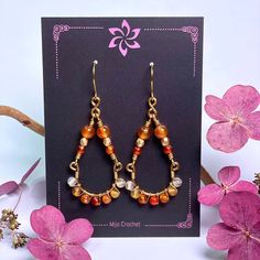 One pair of handmade earrings with 22 Carnelian stones (4 size 6mm + 18 size 4mm) and firepolished Czech glass beads (4mm). These Earrings are shaped by hand and hardened by hammering to make it stronger and harder. Metal used is nickel safe Tarnish Resistant Brass - Artistic Wire®. The color of the stones can vary due to different lights and screens. ❀ ❀ ❀ Carnelian is said to be a stone of courage, endurance, energy, leadership and motivation. ❀ ❀ ❀ Take care of your earrings: - Avoid contact with moisture and chemicals (water, perfume, hairspray, lotion, alcogel etc.) - Take off when showering, exercising or sleeping - Store in a dry, dark place when not in use - If dirty, clean with a soft cloth ❀ ❀ ❀ All my stitch markers and jewelry can be customized. Would you prefer another stone/c Phoenix Tears, Chandelier Jewelry, Artistic Wire, Crochet Bookmarks, Carnelian Stone, Different Light, Style Earrings, Czech Glass Beads, Ear Wire