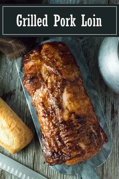 grilled pork loin on a cutting board next to bread and knife with text overlay