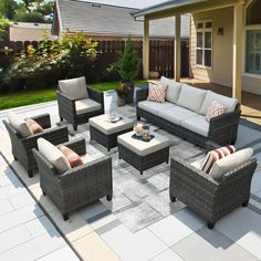 an outdoor living room with furniture on the patio