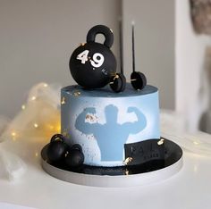 a birthday cake with a mickey mouse figure on it's top and the number forty