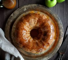 a bundt cake on a plate with orange juice