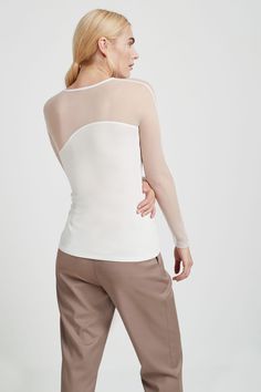 Step out and turn heads with our wave-shaped long-sleeved top in soft, high-stretch and sustainable European jersey, coupled with a soft luxe mesh panel. A minimalist twist on a classic design, Evelyn elevates any cocktail outfit with ease. Pair her with a wrap skirt or vegan leather leggings for an oh-so-glamorous look. Also available in black. | Total length is approximately 24" (62 cm).Sustainable European Jersey (96% Tencel, 4% Elastane). Soft Luxe Mesh (95% Polyester, 5% Elastane).Machine w Cocktail Outfits, Vegan Leather Leggings, Cocktail Outfit, Athleisure Outfits, Mesh Panel, Wrap Skirt, Black Long Sleeve, Mesh Top, Vegan Leather