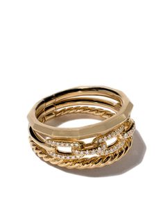 David Yurman’s ‘Stax’ collection combines different finishes and textures with innovative craftsmanship creating the illusion of bracelets and rings stacked as one piece, allowing for effortless layering. Fashioned in 18kt yellow gold, this Stax ring from David Yurman features a signature Cable band, a smooth faceted band and a chain link band embellished with a row of pavé set 0.15ct diamonds. This striking stacked triple ring measures 9.5mm in width. To ensure the shine and polish of your David Yurman piece, wash with a little non-bleach soapy water and wipe clean with a soft cloth. David Yurman Ring Stack, Elegant Stacked Yellow Gold Jewelry, Luxury Yellow Gold Stackable Rings For Everyday, Rings Stacked, Yurman Ring, Jewellery Photography, David Yurman Ring, Triple Ring, Bracelets And Rings