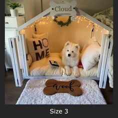 a dog is sitting in his bed with the word woof written on it's side