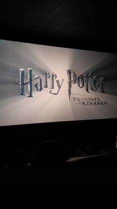 the harry potter logo is projected on a wall