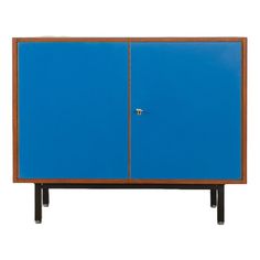 a blue cabinet with two doors on one side and an open door on the other