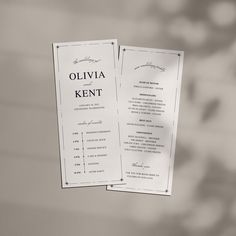 two wedding program cards hanging from a string