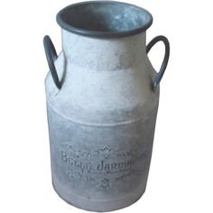 an old metal milk can with handle and handles on the bottom, is shown against a white background