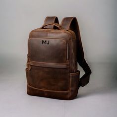 Christmas Day Special offer Flat 70% Off With Free Shipping  ✍✍Free Personalization  Free Gift Wrapping Free Shipping 🎉🎉 HURRY UP ORDER NOW AND GET YOUR ORDER BEFORE CHRISTMAS  🔰 FEATURES: ◾ Unisex Backpack ◾ Made in Full-grain Leather, Excellent Quality ◾ Brown Vintage Color ◾ Padded pocket for laptop in the main compartment ◾ Antique Brass Hardware ◾ YKK Zippers ◾ 2 Pen Holder Slot ◾ Phone Holder and card Holder Slot ◾ Interior Zipper Pocket  ◾ Cotton Lining 🔦Material: Cowhide Genuine Leat Minimalist Laptop Bag, Vintage Leather Backpack, Handmade Leather Backpack, Leather Backpack For Men, Timeless Bags, Leather Laptop Backpack, Brown Leather Backpack, Brown Cowhide, Minimalist Bag