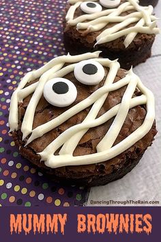 two brownies decorated with white icing and googly eyes