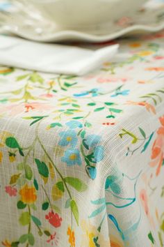 the table cloth has colorful flowers on it