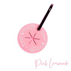 a pink pen holder with the words pink lemonade written on it and a black handle