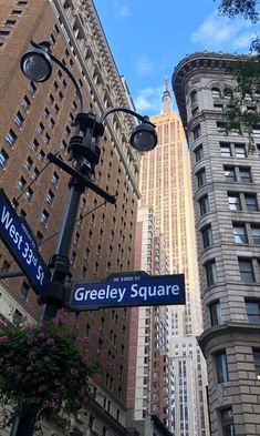 the street signs are clearly visible for everyone to see on this city's streets