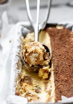 a cake in a pan with a spoon sticking out of it