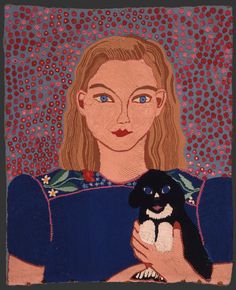 a woman holding a small black and white dog in her arms with dots on the background