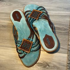 Size 10m Turquoise, Brown, Tan. Turquoise Round Toe Synthetic Sandals, Turquoise Synthetic Sandals With Round Toe, Turquoise Round Toe Sandals For The Beach, Casual Turquoise Synthetic Sandals, Turquoise Leather Sandals For Beach, Casual Flat Turquoise Sandals, Casual Turquoise Flat Sandals, Casual Turquoise Slip-on Sandals, Casual Turquoise Open Toe Sandals