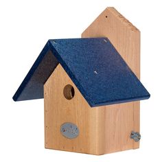 a wooden birdhouse with a blue roof