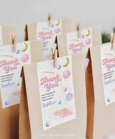 small brown bags with thank you tags attached to them