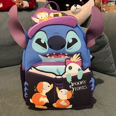 Brand New Loungefly Exclusive Halloween Mini Backpack Stitch Spooky Story Bag Themed Purple Travel Bags, Themed Backpack For Everyday Use And Halloween, Cute Halloween Travel Backpack, Purple School Bag For Halloween, Cute Halloween Backpack For Everyday Use, Purple Backpack For Disney Trips, Loungefly Halloween, Stitch Merchandise, Loungefly Purse