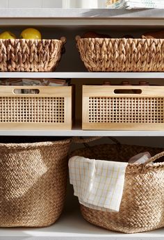 wicker baskets are lined up on the shelves