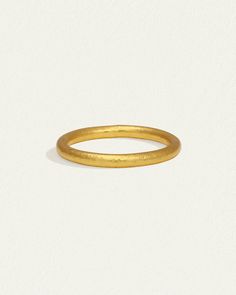 The Tiv Ring is handcrafted from 24k solid gold. Shop minimalist fine jewellery stacking ring with hammered band. Hammered Stackable Open Rings For Weddings, Wedding Hammered Stackable Rings, Wedding Stackable Hammered Open Rings, Gold Hammered Stackable Round Band Rings, Gold Hammered Stackable Rings, Hammered 14k Gold Open Stackable Rings, Hammered Stackable Rings In Recycled Gold, Hammered Recycled Gold Stackable Rings, Minimalist Hammered Yellow Gold Rings