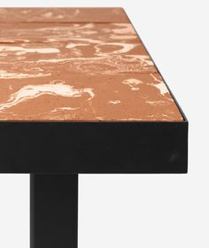 a close up of a table with brown and white paint on it's surface