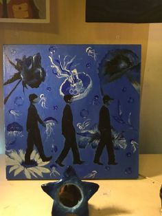 a blue painting with three people walking on it