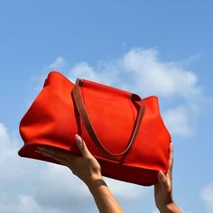 Hermes, Cabag Tote bag in orange canvas with brown leather double handle. Orange canvas lining, one zipped pocket, one patch pocket. HEIGHT: 10,14 in LENGTH: 15,6n WIDTH: 5,85 in SHOULDER STRAP: 22,62 in  NOTE: Our company has a specialization in selling vintage and second-hand clothing and accessories. All the garments are carefully selected and offered for sale in excellent condition. The garments and accessories also are washed and ironed according to the terms of the well 'sterilized labels. Hermes Vintage, Hermes Orange, Vintage Tote Bag, The Well, Purses And Handbags, Unique Pieces, Shoulder Bags, Brown Leather, Vintage Outfits