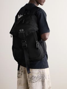 Balenciaga's backpack takes cues from practical hiking styles. It's been made in Italy from durable water-repellent ripstop and embroidered with the brand's 'Unity Sports' logo. It's generously sized to hold a tablet, water bottle and paperback and boasts a host of pockets for keeping the essentials organised. Sporty Nylon Backpack For Overnight Trips, Sporty Hiking Backpack With Adjustable Straps, Nylon Backpack With Adjustable Strap For Overnight Trips, Sporty Backpack For Overnight Trips, Functional Nylon Backpack For Overnight Trips, Nylon Outdoor Backpack, Standard Nylon Backpack For Outdoor, Outdoor Nylon Standard Backpack, Nylon Backpack With Water Bottle Pocket For Adventure