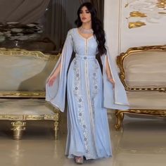 Elevate your style with our Dreamy Vow Luxury Dubai Moroccan Kaftan. Featuring a stunning blue evening dress with elegant long sleeves, this dress is perfect for any formal occasion. Made with high-quality materials, it's perfect for a wedding party or any special event. Stay elegant and stylish with this Muslim Arabic Custom Flower Girl Dress, Yellow Evening Dresses, Silver Evening Dress, Blue Evening Dress, Purple Evening Dress, Champagne Evening Dress, Green Evening Dress, Girls Long Dresses, Pink Evening Dress