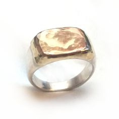 A pinky ring made of sterling silver and 10k red gold sheet soldered on top. This ring can fit other fingers as well. The gold can be red (pink), white or yellow gold if you wish. Measurments: Width: 0.43 inch x 0.59 inch / 11 mm x 15 mm Thickness: 0.11 inch / 3 mm This listing is for sizes 3.5-8. For other sizes - please convo me. Additional information If you liked this item, you may also want to look at these pieces: http://etsy.me/2fHziIR http://etsy.me/2fivdh1 For customer reviews of our sh Hand Forged Sterling Silver Signet Ring For Anniversary, Handmade 14k Gold Silver Signet Ring, Silver Hammered Signet Ring As Gift, Rose Gold Sterling Silver Signet Ring, Engraved Rose Gold Sterling Silver Signet Ring, Silver Hammered Signet Ring For Anniversary, Rose Gold Sterling Silver Engraved Ring Hallmarked, Rose Gold Sterling Silver Engraved Ring, Rose Gold Sterling Silver Engraved Ring With Hallmark