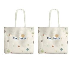 two white bags with dots on them and the name, the native written in blue