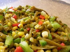 a plate full of food including beans, carrots and celery