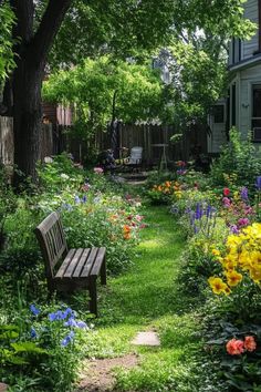 a wooden bench sitting in the middle of a lush green yard filled with flowers and trees