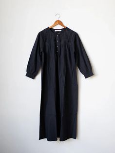 This versatile night dress, reminiscent of days spent harvesting and feeding chickens, offers more than just comfort. For us, it's an "everything dress" designed for cozy evenings in or out of the house and productive work-from-home days. It suits any virtual meeting or school drop-off. Black Cotton Sleep Dress, Feeding Chickens, Virtual Meeting, Black Nightgown, Productive Work, Cotton Nightgown, Spring Fever, Autumn Harvest, Cozy Autumn