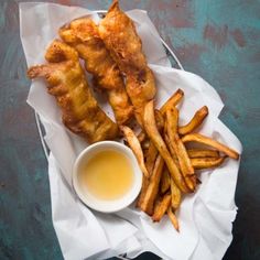 chicken wings and french fries with dipping sauce