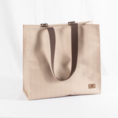 Simple Shopper Beige Recyclable Shopping Bags, Eco-friendly Square Canvas Bag For Shopping, Eco-friendly Square Canvas Shopping Bag, Modern Bags With Leather Handles For Market, Eco-friendly Canvas Travel Bag With Reinforced Handles, Modern Rectangular Beach Bag For Everyday Use, Modern Rectangular Beach Bag For Everyday, Natural Bags With Reinforced Handles For Everyday Use, Beige Recyclable Tote Shoulder Bag