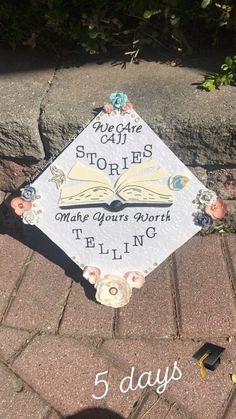 a graduation cap sitting on top of a brick sidewalk with the words 5 days in front of it