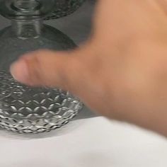 a person is touching the water in a sink