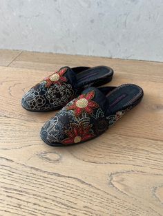 Beautiful pair of vintage slip on mules by Frankie & Baby by Beverly Feldman, in a black silk with whimsical floral embroidery with beaded embellishments.   Size 6. I have two pair of those, both are in a good vintage condition, the cord around the foot entrance shows wear and rub off of the material, though the loafers themselves still have lots of life left. These shoes will definitely make a statement! beautiful craftsmanship! Thank you for your interest! Bohemian Closed Toe Slippers For Spring, Bohemian Spring Closed Toe Slippers, Bohemian Round Toe Slippers For Spring, Traditional Round Toe Slippers For Spring, Traditional Black Round Toe Slippers, Traditional Slip-on Mules For Spring, Floral Embroidery Slip-on Flats, Traditional Flat Slippers For Spring, Red Suede Shoes