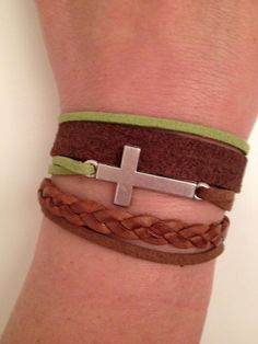 This is a genuine leather bracelet , with a sweet little cross, a provocative braid and a cute faux suede strip.The bracelet is adjustable and fits wrists from 51/2 to 81/2" (14cm to 22cm). The width is about 11/8". Finishing, alloy lobster clasp with extension chain.This exotic mix makes a unique and fun bracelet, add it to any outfit for the perfect touch of urban chic.Modern urban feel in beautiful natural colors.This bracelet is an ideal treat for youself or perfect as a GIFT for anyone you Genuine Leather Bracelet, Fun Bracelet, Cross Bracelet, Urban Chic, Green Leather, Christmas Gift Ideas, Faux Suede, Lobster Clasp, Leather Bracelet