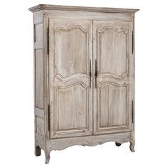 an old white wooden cabinet with two doors