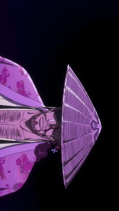 an upside down view of a pink umbrella on a black background with the image of a woman's face reflected in it