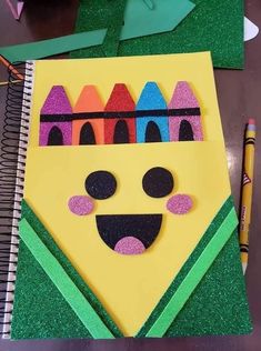 an art project made out of construction paper and colored crayons