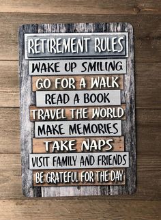 a wooden sign that says retirement rules