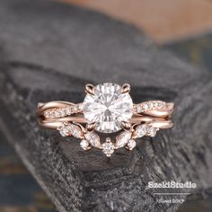 a rose gold engagement ring with diamonds on top